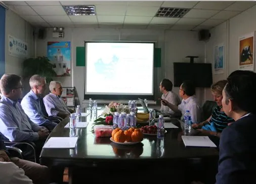 Both teams discussing hospital development and international cooperation in the conference room